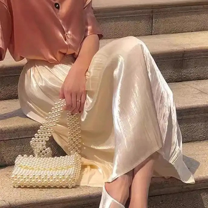 Upgrade Your Wardrobe with Our Spring and Autumn Half Length Pleated Skirt - Featuring Pearlescent Fabric and Elegant Pleats!