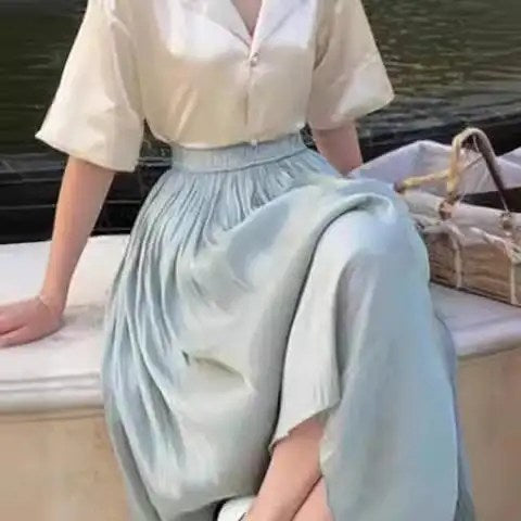 Upgrade Your Wardrobe with Our Spring and Autumn Half Length Pleated Skirt - Featuring Pearlescent Fabric and Elegant Pleats!
