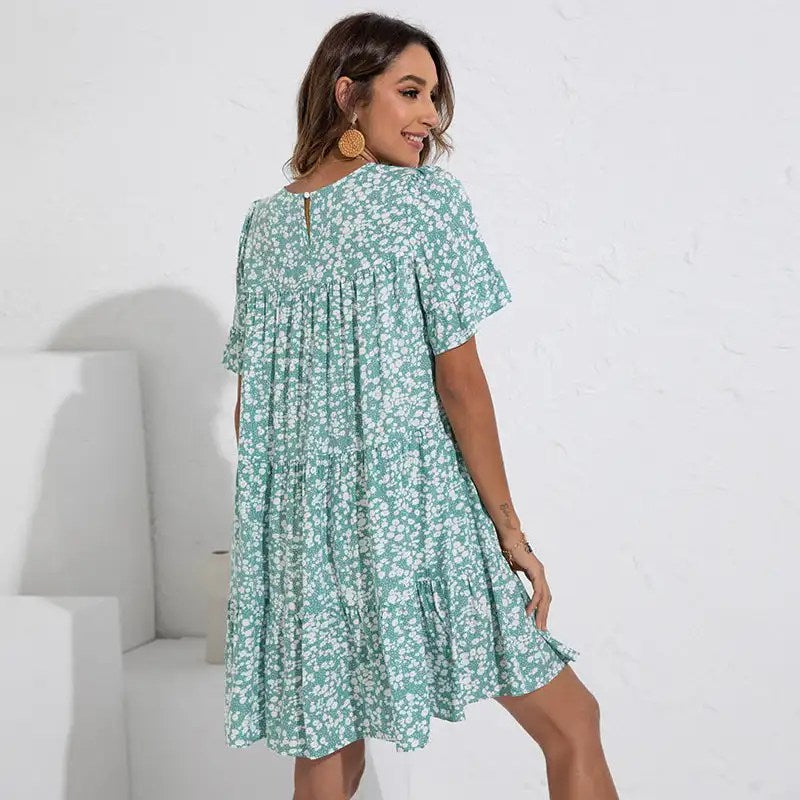 Stay Stylish this Summer with our Loose Fitting Floral Summer Dress for Women - Featuring Round Neck and Fragmented Leaf Sleeves!